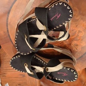'Torrid' brand wedge sandals with leg ties.      Size 9